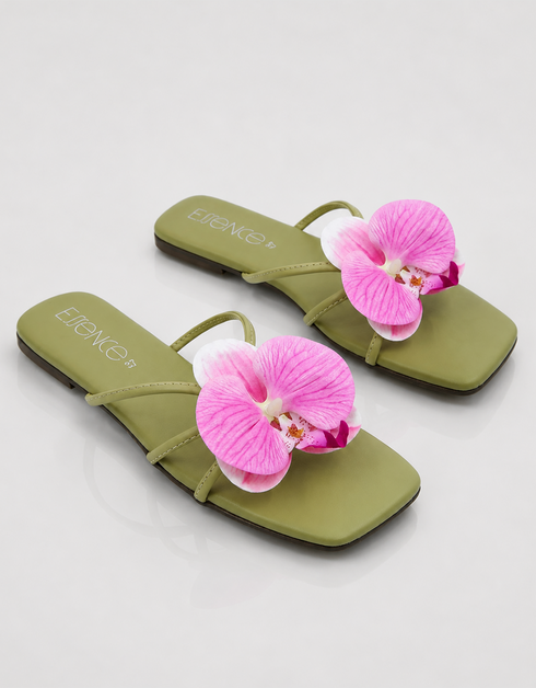 Pair of olive green flat sandals with pink orchid flower detail summer footwear