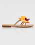 Side view of yellow floral flat sandal with orchid detail and minimal straps