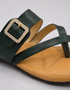 Close up of green buckle flat sandals highlighting the decorative buckle and premium craftsmanship.