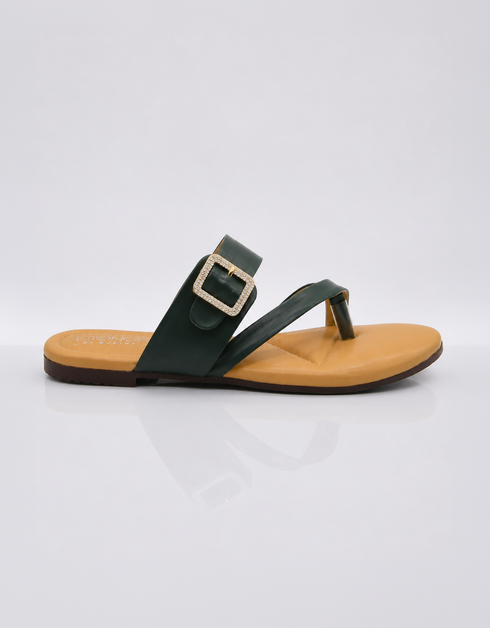 Side view of green buckle flat sandals with lightweight slip on construction.