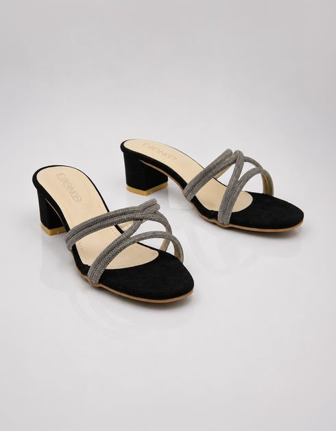 Pair of black embellished low block heel slippers with elegant shimmer crossover straps.