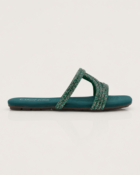 Side view of teal embellished flat sandals featuring a lightweight slip on design.