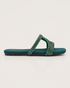 Side view of teal embellished flat sandals featuring a lightweight slip on design.