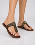 Woman wearing Brown embellished Kolhapuri flats with toe ring ethnic styling