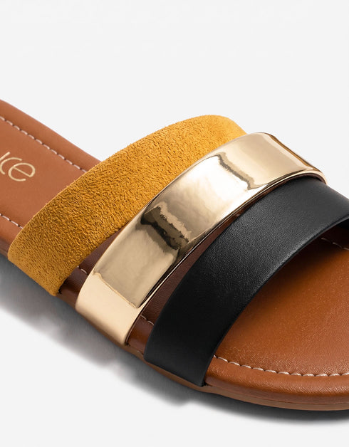 Close up of mustard dual straps with polished metallic accent showcasing premium craftsmanship.