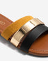 Close up of mustard dual straps with polished metallic accent showcasing premium craftsmanship.