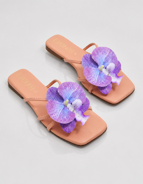 Pair of flat sandals with purple orchid flower detail stylish summer footwear