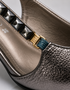 Close up of metallic finish and chain detail strap on Zehra slingback kitten heels