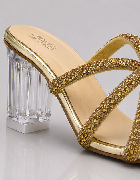 Close up sculpted transparent ribbed block heel and gold metallic footbed on Auryn heels by Essence by Rubina Pakistan