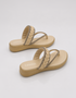Beige thong flat sandals pair