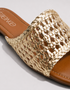 Gold woven sandal with brown leather sole on a light gray background