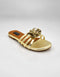 Imperial gold handmade flat sandals front view with metallic flower embellishment by Essence by Rubina
