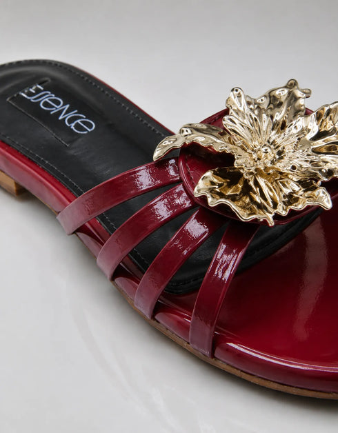 Imperial maroon flat sandals studio shot showing patent strappy upper and comfort sole by Essence by Rubina