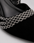 Close up of shimmering embellished strap on Twilight black slingback heels